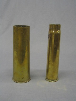 A WWI 6lbs shell case together with a WWI 18lbs brass shell case (2)
