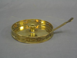 A circular pierced brass chamber stick 8"
