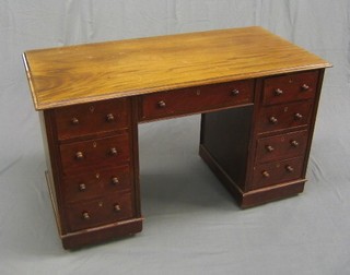 A Victorian mahogany kneehole pedestal desk/dressing table, fitted 1 long and 8 short drawers, 49"