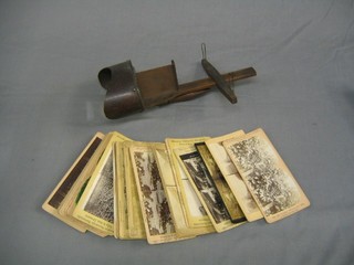 A wooden stereoscopic viewer and 25 slides including Baiden Powell and foreign scenes