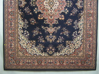 A blue ground machine made Persian style carpet 135" x 94"