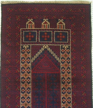 A contemporary red ground Afghan prayer rug 54" x 32"