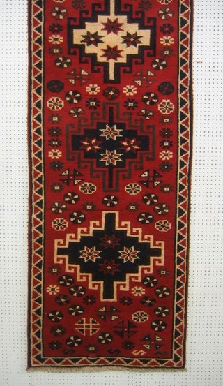 A Persian Shiraz runner with red and blue ground and all over geometric design 115" x 30"