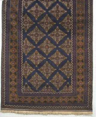 A contemporary black ground Afghan Belouch rug with central field within multi row borders 80" x 43"