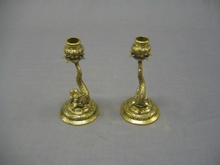 A pair of Venetian brass candle sticks in the form of dolphins, bases marked Made in Venice 8"