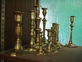 10 various brass candlesticks