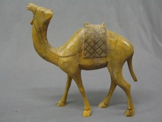 A large carved wooden figure of a standing camel 16"