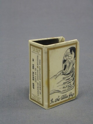 A WWII enamelled match slip "The Greatest Enemy of History Against Humanity, All The Alliances Grip"