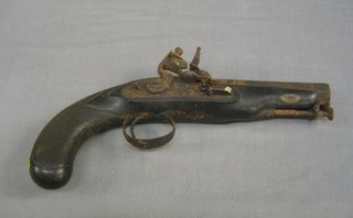 An 18th Century flint lock pistol with carved diamond walnut grip, 6" octagonal barrel with stirrup ram rod (corroded some rust to the barrel)