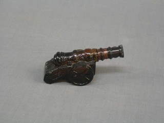 A bottle of Avon "Wild Country" after shave in the form of a Siege Cannon 