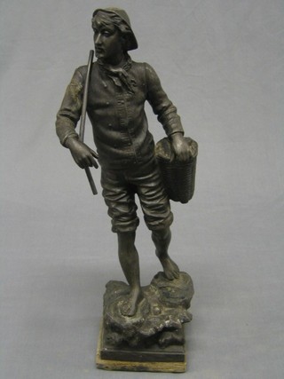 A spelter figure of a standing fisherman, raised on a wooden base 19" (f)