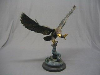 An impressive 20th Century bronze figure of a diving eagle