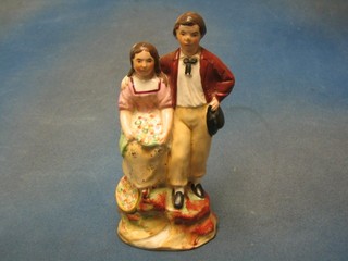 A 19th Century Staffordshire style figure of a lady and gentleman 8"