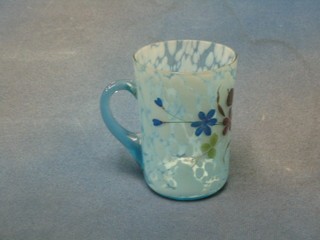 An opaque blue glass beaker decorated a flower 4"