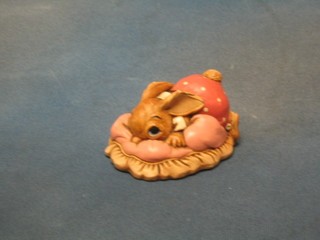 A Pendelfin figure of  a rabbit reclining on a cushion 4"