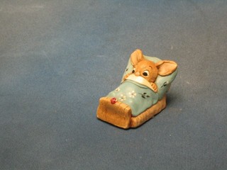 A Pendelfin figure of a rabbit in bed looking at a ladybird 4"