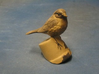 A Poole Pottery figure of a seated sparrow on flower pot, base marked Poole Pottery and incised JUV 5"