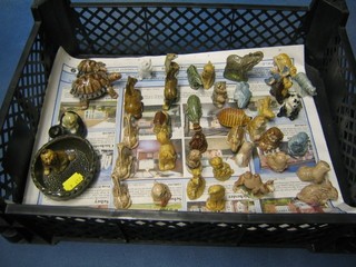 A Wade ashtray in the form of a basket with dog, do. pen rest and 37 various Wade Whimsies: 2 x tortoises, 4 x giraffes, seated horse, scotty dog, 2 x koala bear, squirrel, Old woman who lived in a shoe, standing shire horse, scotts girl with pig, monkey, Mr Pickwick, mole, badger, eagle, boy with pie, dinosaur, hedgehog, standing elephant, teddybear, camel, seated dog (ear f), 2 x seated cat with ball of wool, leopard, seated dog, hippopotamus, rabbit, bull dog, sea lion, panda, rhino (horn f), Labrador, blue bird