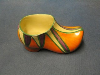 A Clarice Cliff Bizarre spill vase in the form of a shoe, the base marked Clarice Cliff Bizarre, 6"