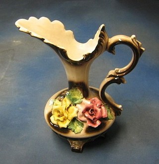 An Italian pottery ewer with floral decoration, 14" (some damage)