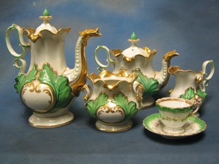 A 12 piece Tim porcelain tea/coffee service comprising teapot (crack to base), coffee pot (crack to base), twin handled sucrier (lid missing), cream jug, 4 cups and saucers with green leaf and gilt banding (gilding rubbed)