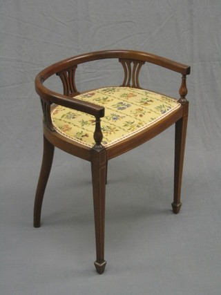 An Edwardian inlaid mahogany tub back piano stool with upholstered seat and on square tapering supports ending in spade feet