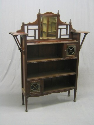 An Art Nouveau Arts & Crafts mahogany bookcase with raised back fitted shelves, 46"