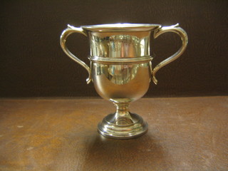 A silver twin handled trophy cup, Birmingham 1914, engraved Maidenhead Amateur Regatta, 1914, raised on a circular base 6 ozs
