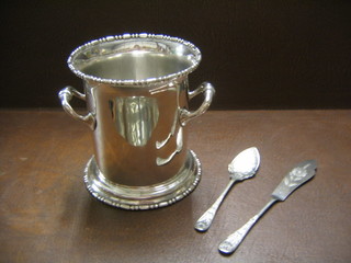 A silver plated twin handled soda siphon holder and a silver plated jam spoon and a do. fish knife