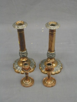 A pair of 19th Century silver plated candlesticks 9" and a small pair of copper candlesticks 4"