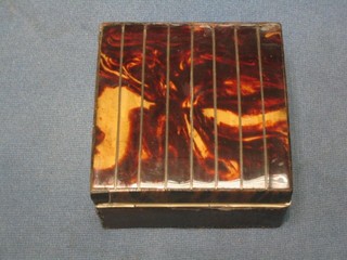 An Art Deco tortoiseshell and leather cigarette box with hinged lid 4"