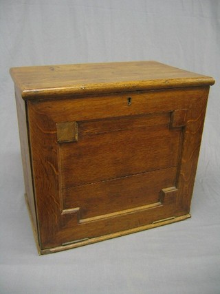 A late 19th/20th Century apothecaries cabinet with hinged lid, the interior fitted various bottle recepticals and drawers 20"