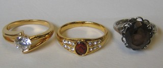 2 gilt metal dress rings and a silver dress ring set a quartz stone