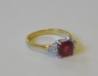 A lady's attractive 18ct yellow gold dress ring set a square cut ruby (approx 1.72ct) supported by 6 diamonds (approx 1.8ct)
