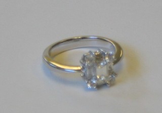 A lady's 18ct white gold dress ring set 4 diamonds to the corners and 5 baguette cut diamonds