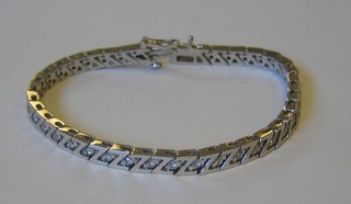 A lady's attractive 18ct white gold bracelet constructed of Z shaped links set diamonds