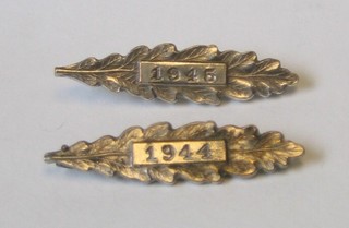 2 silver oak leaves dated 1944 and 1945 (Kings Commendation?) 