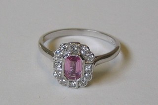 A lady's 18ct white gold dress ring set a rectangular cut pink sapphire surrounded by diamonds (approx 0.82 ct)