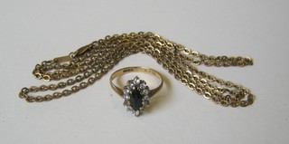 A lady's 9ct gold dress ring and a gilt metal chain