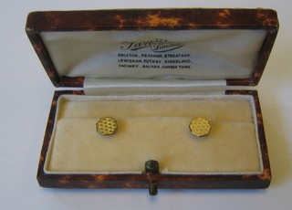 A pair of 9ct gold octagonal dress studs, boxed