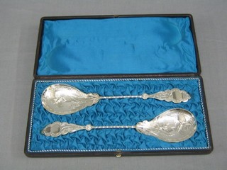 A pair of silver plated fruit servers engraved butterflies, cased