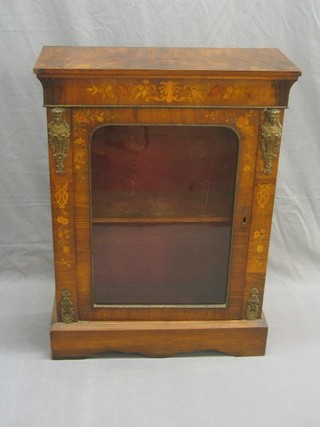 A Victorian figured walnut and inlaid marquetry pier cabinet with gilt metal mounts to the sides, the interior fitted a drawer enclosed by an arch shaped panelled door, raised on bracket feet 31" (escutcheon missing) 