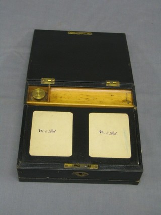 A Victorian black leather writing case, the interior fitted a cut glass inkwell 8 1/2"