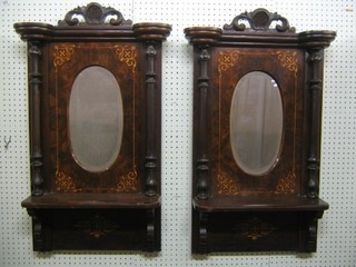 A pair of Victorian oval bevelled plate wall mirrors contained in inlaid figured walnut frames the base fitted shelves 90" (formerly part of a sideboard)