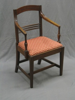 A 19th Century mahogany bar back desk chair with plain mid rail and upholstered drop in seat, raised on turned supports