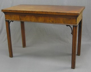 A handsome Georgian mahogany console table of rectangular form, the crossbanded top with deep apron, raised on chamfered supports with pierced brackets to the corners (top missing 2 sections of veneer and veneer lifting to the side) 49"