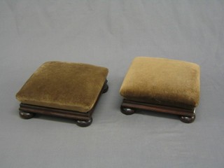 A pair of square Victorian mahogany footstools, raised on bun feet 11"