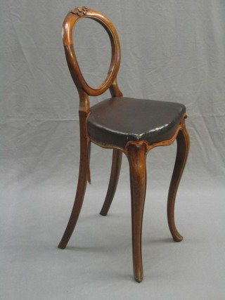 A Victorian  carved mahogany balloon back  childs training chair (old repair to back), raised on French cabriole supports