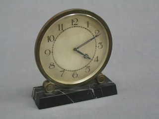 An Art Deco 8 day bedroom timepiece with circular silvered dial and Arabic numerals, raised on a marble base