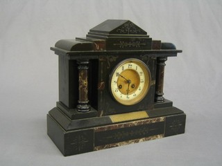 An Edwardian French 8 day striking mantel clock with porcelain dial and Arabic numerals contained in a black and grey marble architectural case